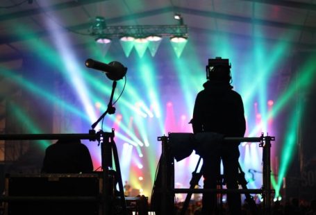 Visual Hierarchy - silhouette of man standing on stage