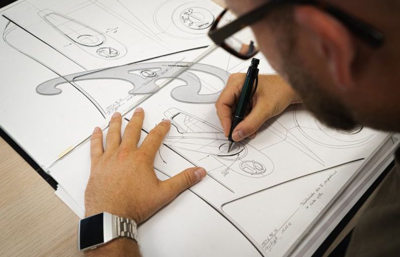 Product Design - person writing on white paper