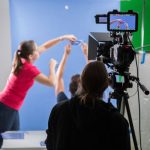 Video Marketing - woman in pink long sleeve shirt holding black video camera