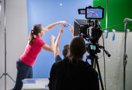 Video Marketing - woman in pink long sleeve shirt holding black video camera