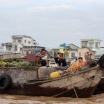 Buyer Journey - a group of people sitting on top of a wooden boat