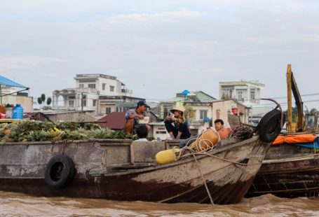Buyer Journey - a group of people sitting on top of a wooden boat