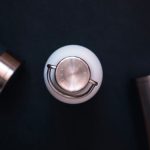 Content Recycling - silver and black round device