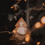 Trends Forecast - a wooden christmas tree with lights around it