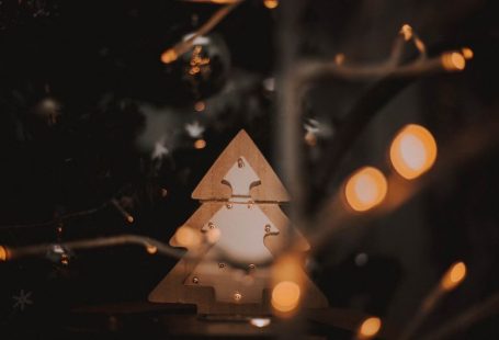 Trends Forecast - a wooden christmas tree with lights around it