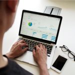 Analytics Graph - person using MacBook Pro