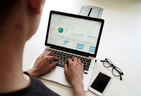 Analytics Graph - person using MacBook Pro