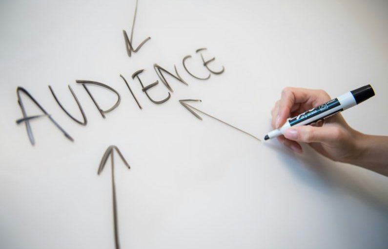 Omnichannel Marketing - person writing on white paper