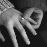 Visual Engagement - woman wearing wedding ring with man holding hand