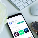 TikTok Marketing - black android smartphone beside silver and gold round analog watch