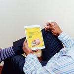 Cross-platform Branding - a man holding a tablet