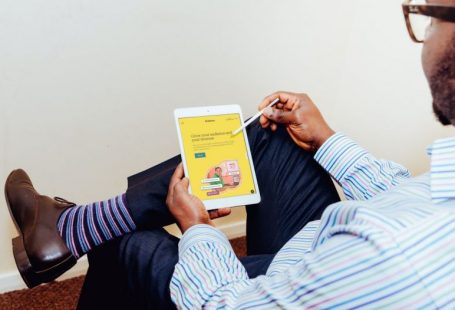 Cross-platform Branding - a man holding a tablet