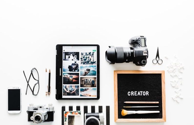 Influencer Marketing - flat view of cameras beside computer tablet and smartphone