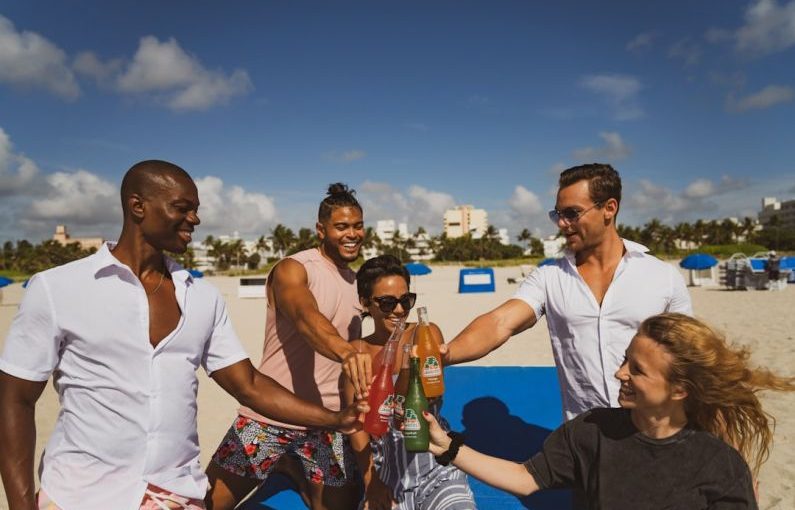 Brand Activation - group of people standing on beach during daytime