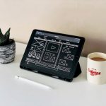 Website Design - black ipad beside white ceramic mug on white table