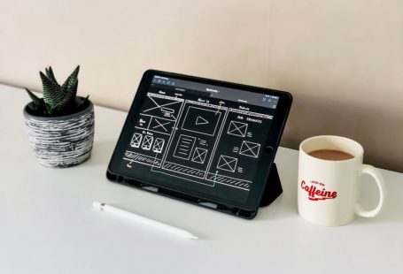 Website Design - black ipad beside white ceramic mug on white table