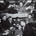 Navigation Design - a group of men sitting around a bunk bed