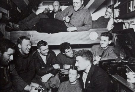 Navigation Design - a group of men sitting around a bunk bed