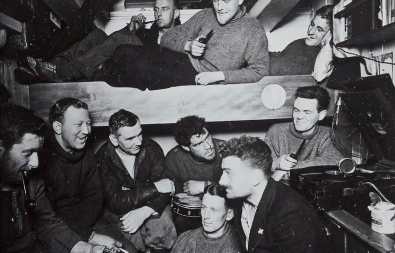 Navigation Design - a group of men sitting around a bunk bed
